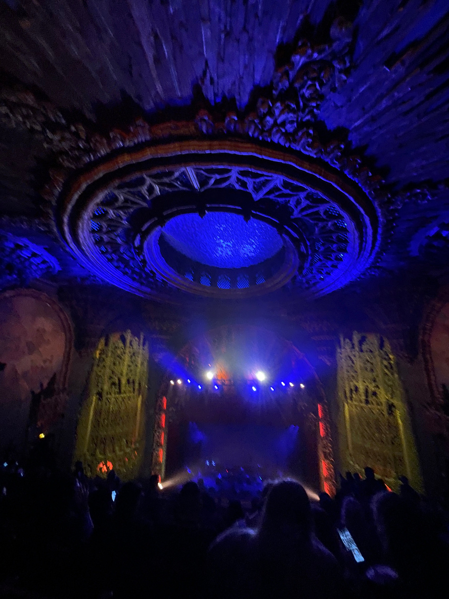 Concert venue — ornate theatre ceiling with blue dome lighting