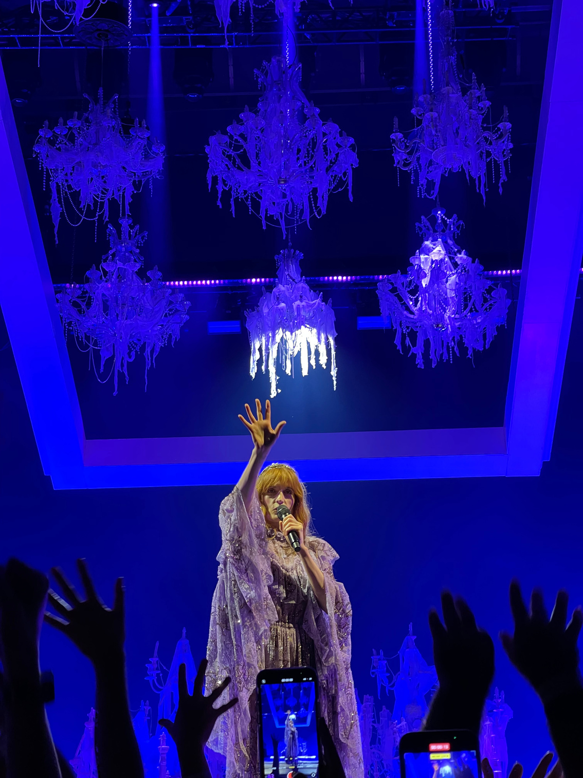 Concert photograph — Florence and the Machine, blue chandelier light